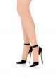 Beautiful woman`s feet with black shoes