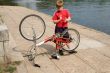 boy repairs the bicycle