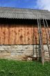 Bright wooden cow-house and blue sky