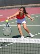 Young girl playing tennis