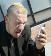 Frustrated Punk Businessman on his Cell Phone