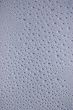 Drippy spots on glass pane.