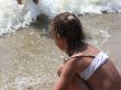 Small girl looking at the sea