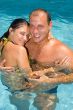 An attractive couple relaxing by the pool