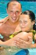 An attractive couple relaxing by the pool