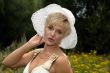 blonde woman in a white hat