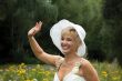 blonde woman in a white hat