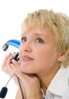 blond woman listening to music with headset