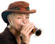 woman drinking dark beer