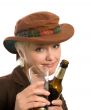 blonde woman in a hat with a beer bottle