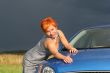 young sexy woman and a car