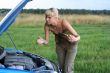 young woman with her broken car