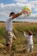 Father with ball and baby