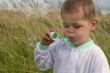 Baby with soap bubble