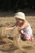 Child plays sand