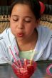 Birthday girl blowing out candles