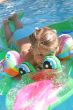 Girl swimming on crocodile