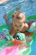 Girl swimming on crocodile