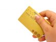 Hand holding credit card, clipping path included