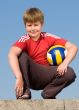 sitting boy with ball