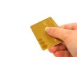 Hand holding credit card (clipping path included)