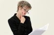 Businesswoman reading a paper