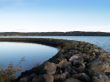 a rock barrier at a marina