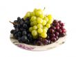 fresh red, black and white grapes on a plate
