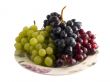 fresh red, black and white grapes on a plate