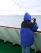 Cruise ship tourist in blue parka