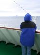 Cruise ship tourist in blue parka