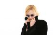 Blonde woman in long black coat