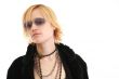 Blonde woman in furry coat and sunglasses