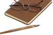 Book with pen and glasses