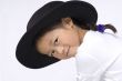 Posing with a hat