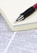 Paper and Pen on Dictionary