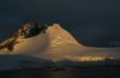 Golden glacier and mountain sunset