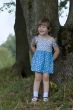 Cheerful little girl in the woods