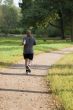Bold man joging in the park
