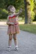 Girl appreciating whe stone she holding