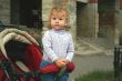 Baby standing in pram