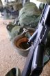 a rifle and a soldier helmet