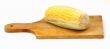 A corn on a wooden plate