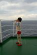 A child boy on deck of cruise ship
