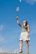 woman playing badminton