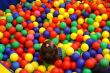 child girl inside a balls pool