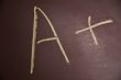 Chalkboard with an A plus written on it