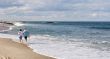 A couple walking along the beach