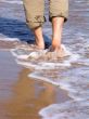 Man walking barefood on the beach