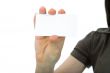 Hand keeps business card on white background